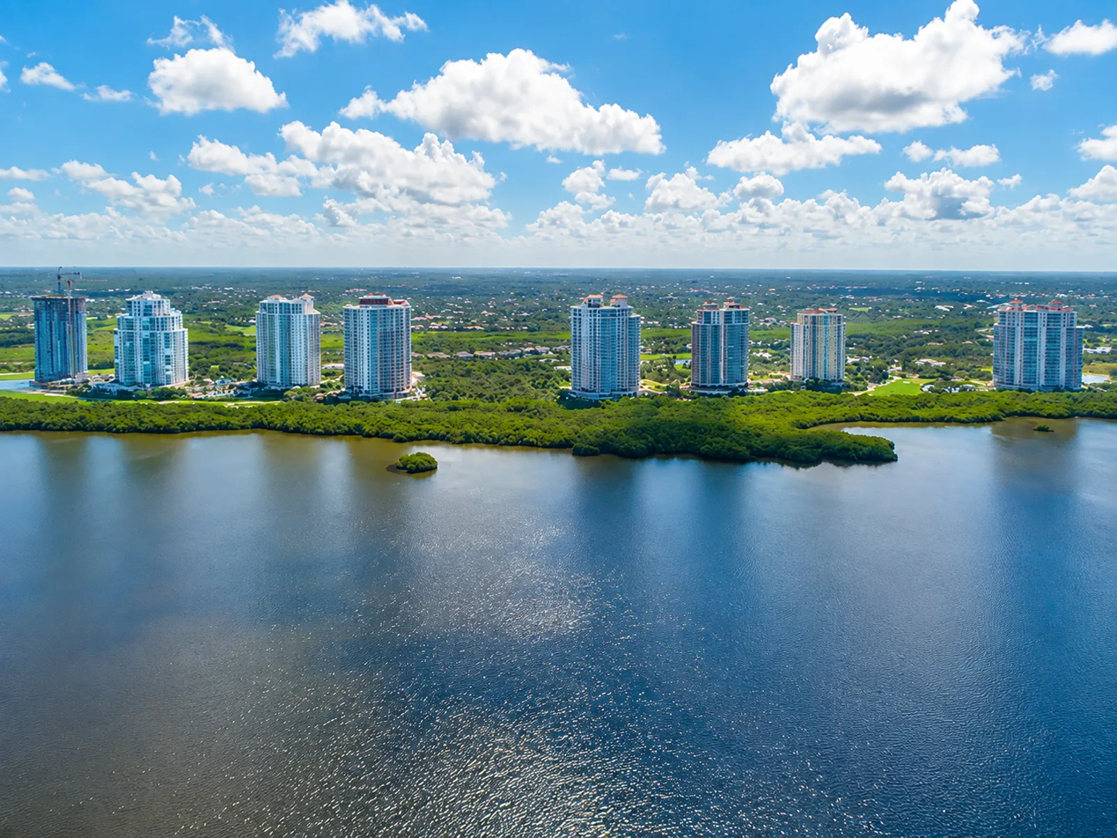 SW Florida condo insurance - aerial view of high-rise condominium towers along Estero Bay in Southwest Florida
