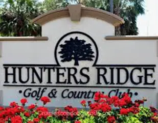 Hunters Ridge Golf & Country Club entrance sign in Bonita Springs Florida - home insurance coverage by Insurance Specialists